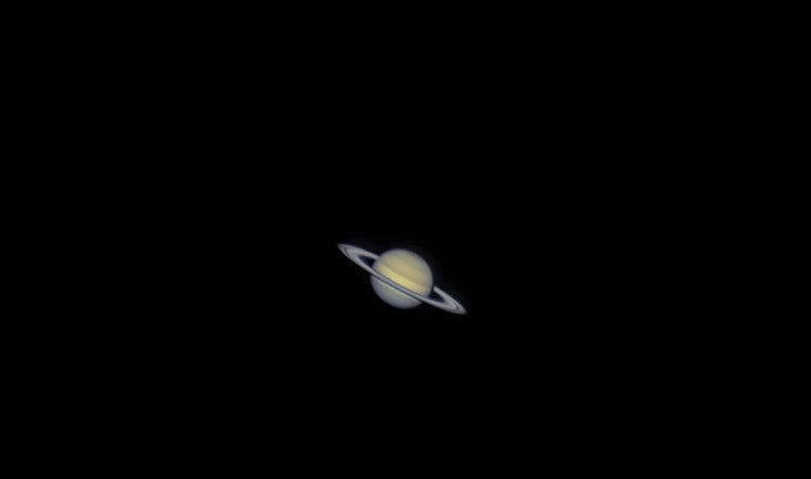 A clear view of Saturn in a dark sky, highlighting its iconic rings and vibrant colors.